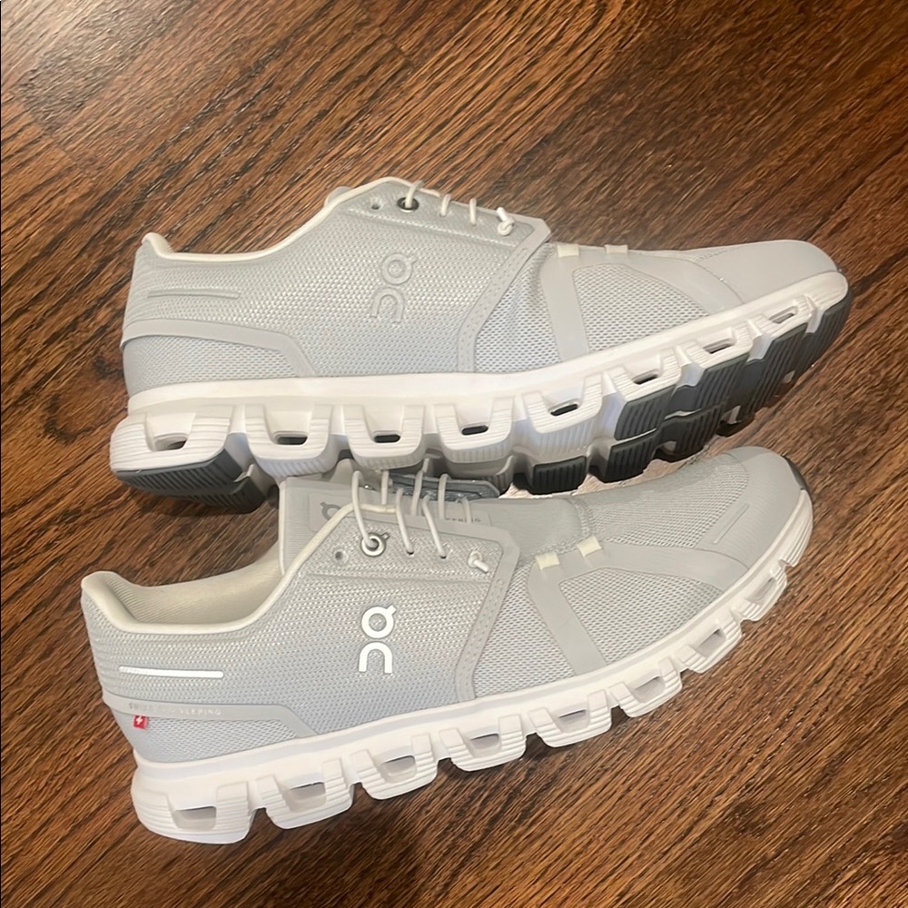 On Running Gray and White Athletic Shoes with Cloud Cushioning